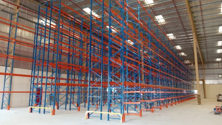 Tall industrial pallet racking system in a large UAE warehouse by Metal Masters